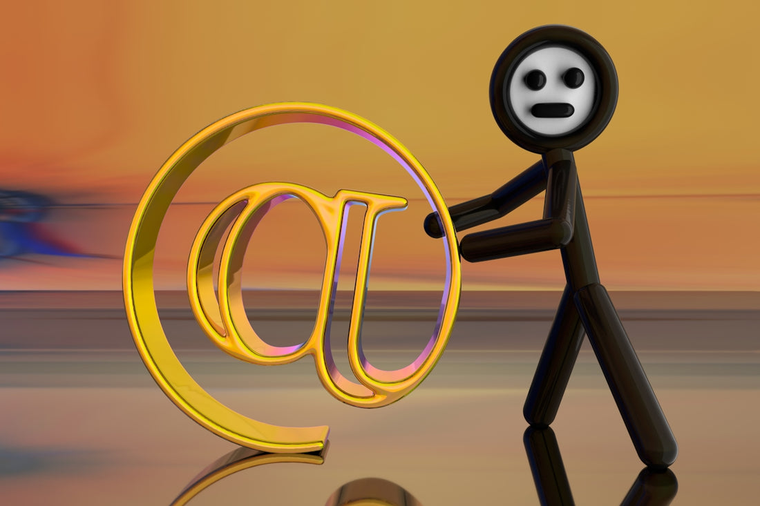 Stick figure holding a golden email symbol.